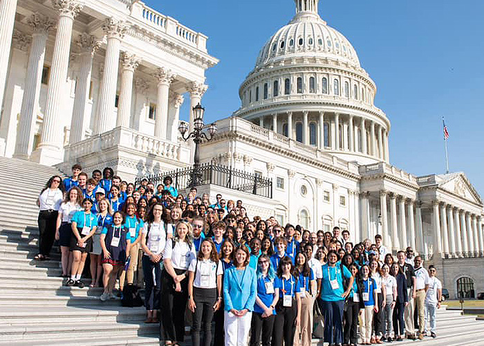 Group of Youth & Government Participants pose for a picture in front of capitol