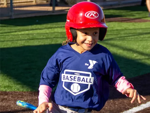 Girl playing youth baseball at the Y