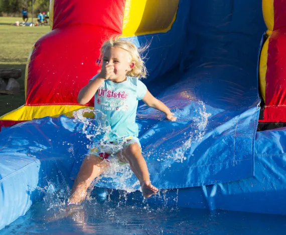 Having fun on the water slide at the Y!