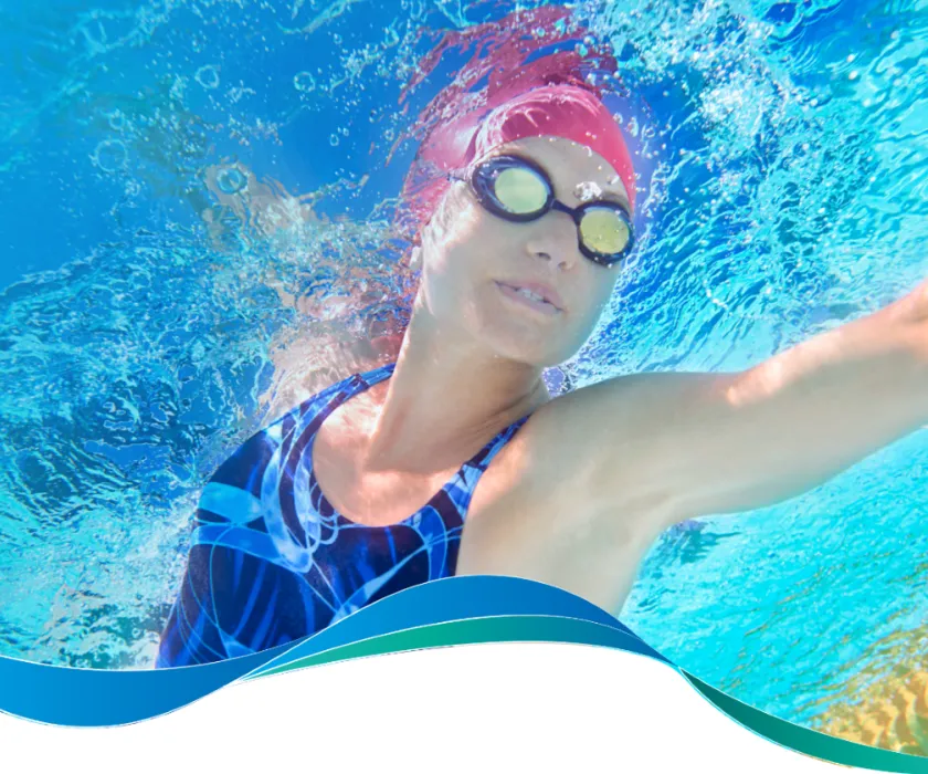 Underwater image of a woman swimming in a pool