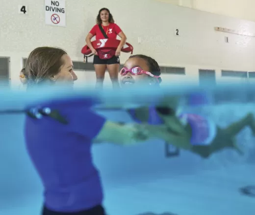 School Age Child taking swim lessons at the Y