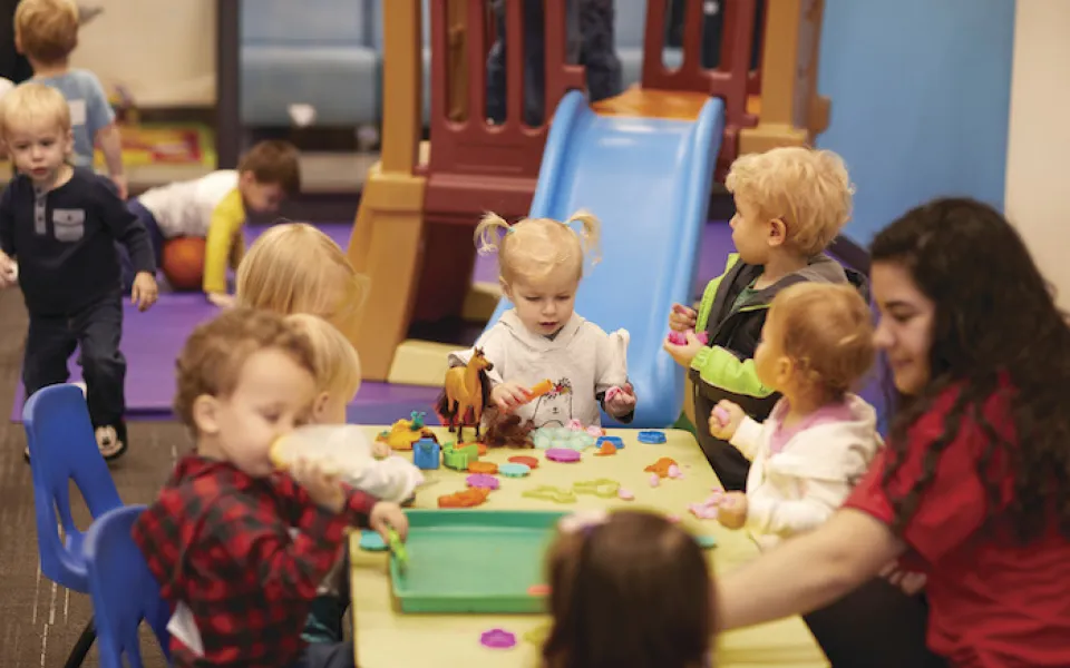 Pre-Schoolers at the Y's Early Learning Center playing with various toys